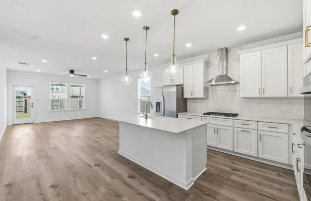 a large kitchen with stainless steel appliances kitchen island a large island in the center