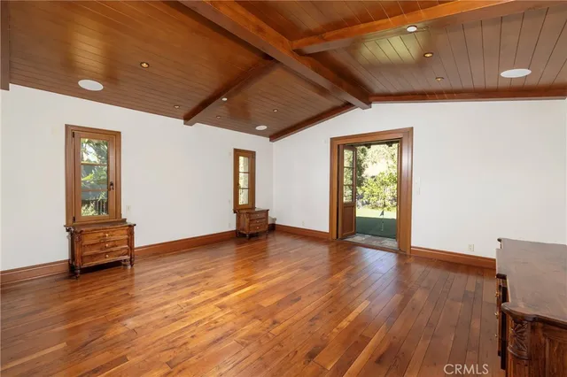 a bedroom with a large bed and a large window