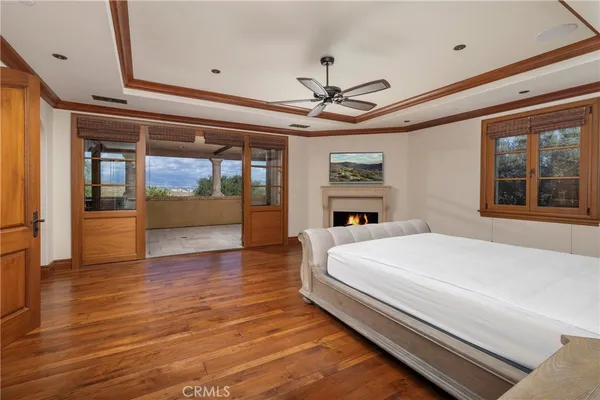 a spacious bathroom with a tub a sink and mirror