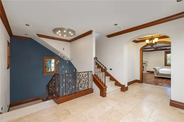 a large bathroom with a tub a sink and a large mirror