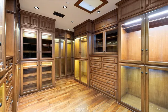 a view of a hallway and a livingroom with furniture