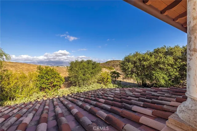 a view of a patio with a table and chairs