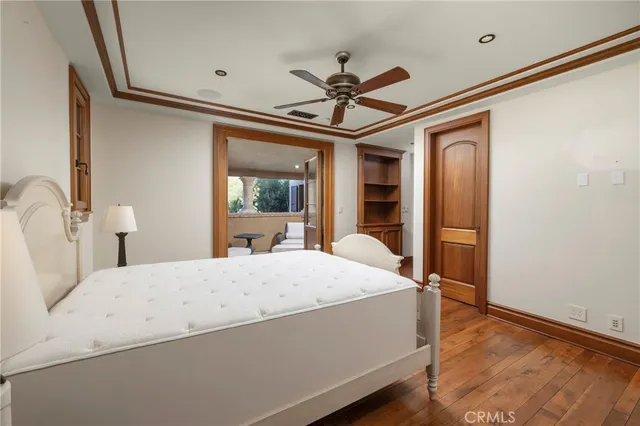a view of a room with wooden floor and carpet