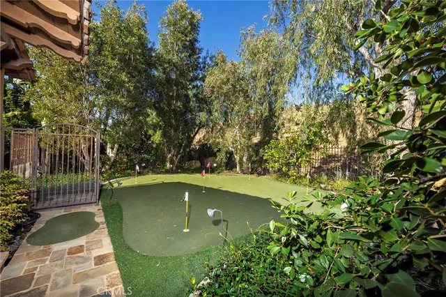 a view of a garden with a building