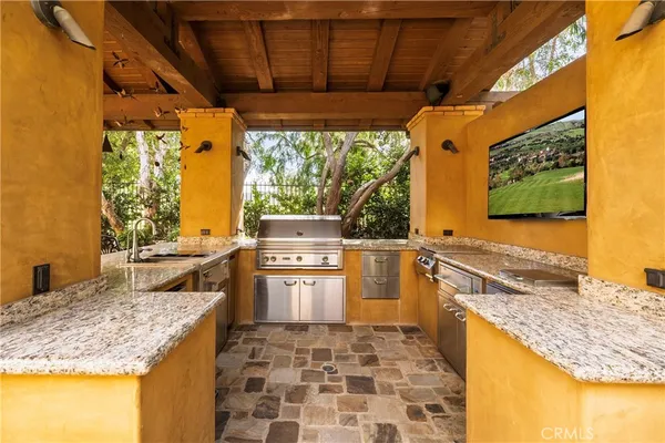 a view of a swimming pool with a patio and a garden