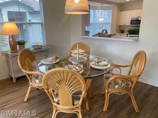 600 Diamond Circle, Unit 607 Naples, FL 34110 - Photo 11 of 12 a dining room with furniture and wooden floor