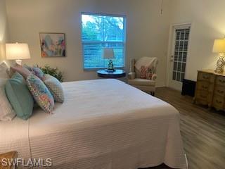 600 Diamond Circle, Unit 607 Naples, FL 34110 - Photo 4 of 12 a bedroom with a bed and window