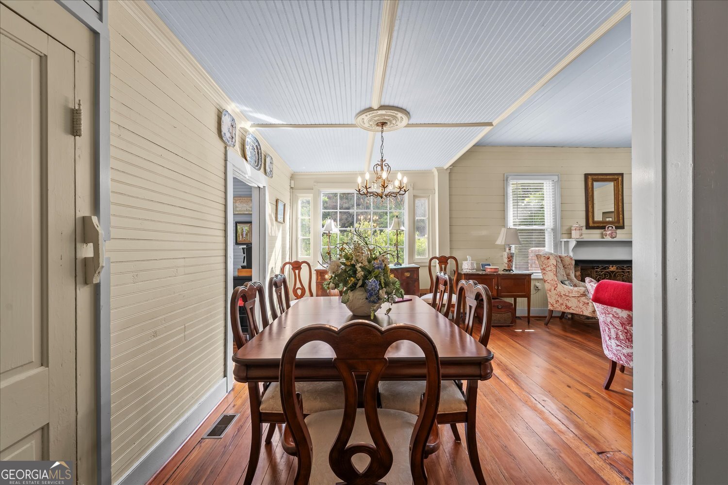6644 East Cadley Road Norwood, GA 30821 - Photo 23 of 53 a view of a dining room with furniture window and wooden floor