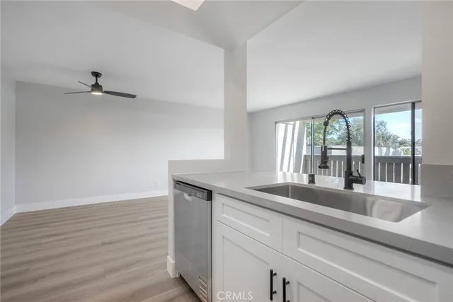 a kitchen with a sink and large window