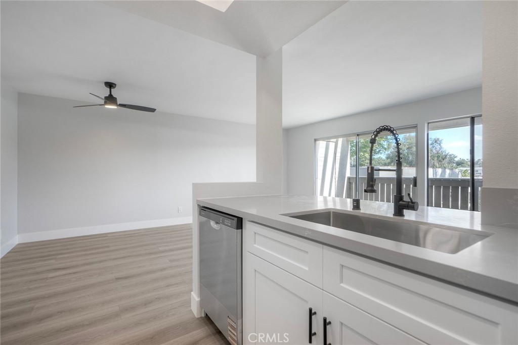 149 West Glaucus Street, Unit D Encinitas, CA 92024 - Photo 8 of 29 a kitchen with a sink and large window