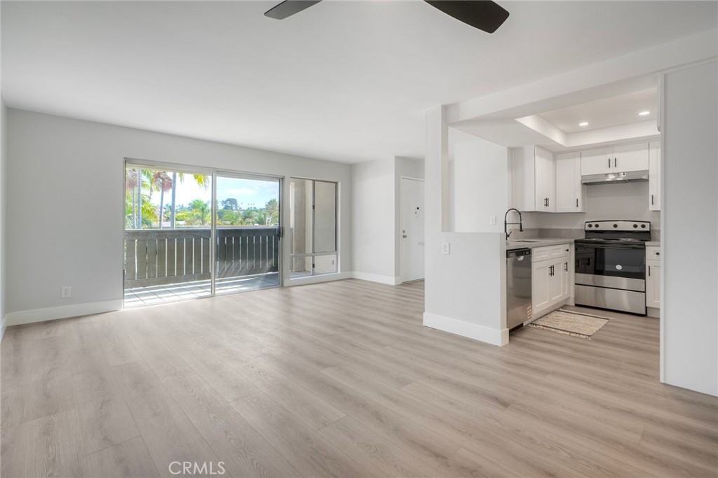 149 West Glaucus Street, Unit D Encinitas, CA 92024 - Photo 9 of 29 a view of a kitchen with a stove cabinets and wooden floor