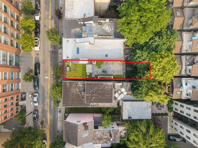 a view of a patio with wooden floor and windows