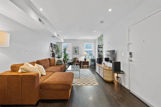 a living room with furniture and a couch