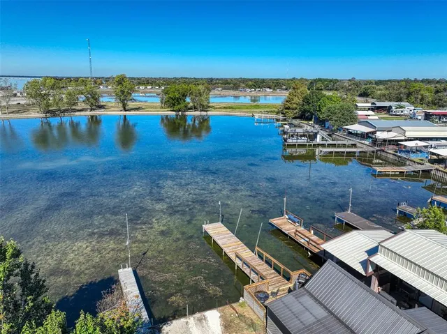 an aerial view of a house with ocean view