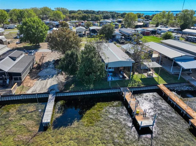 a view of a lake with a house in the background