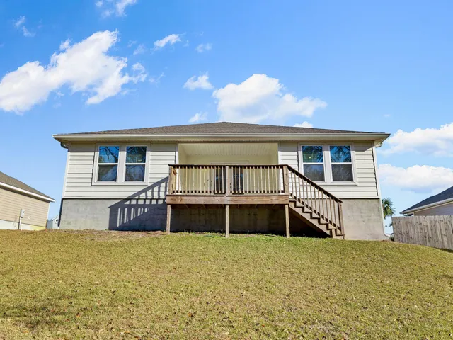 a view of a two chairs in the balcony