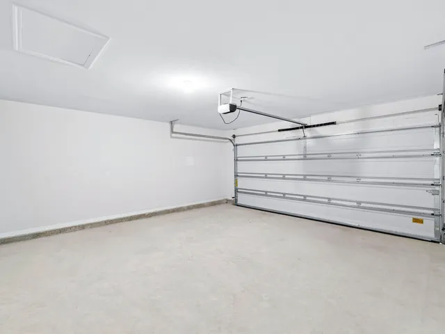 an aerial view of a house with a garden and swimming pool