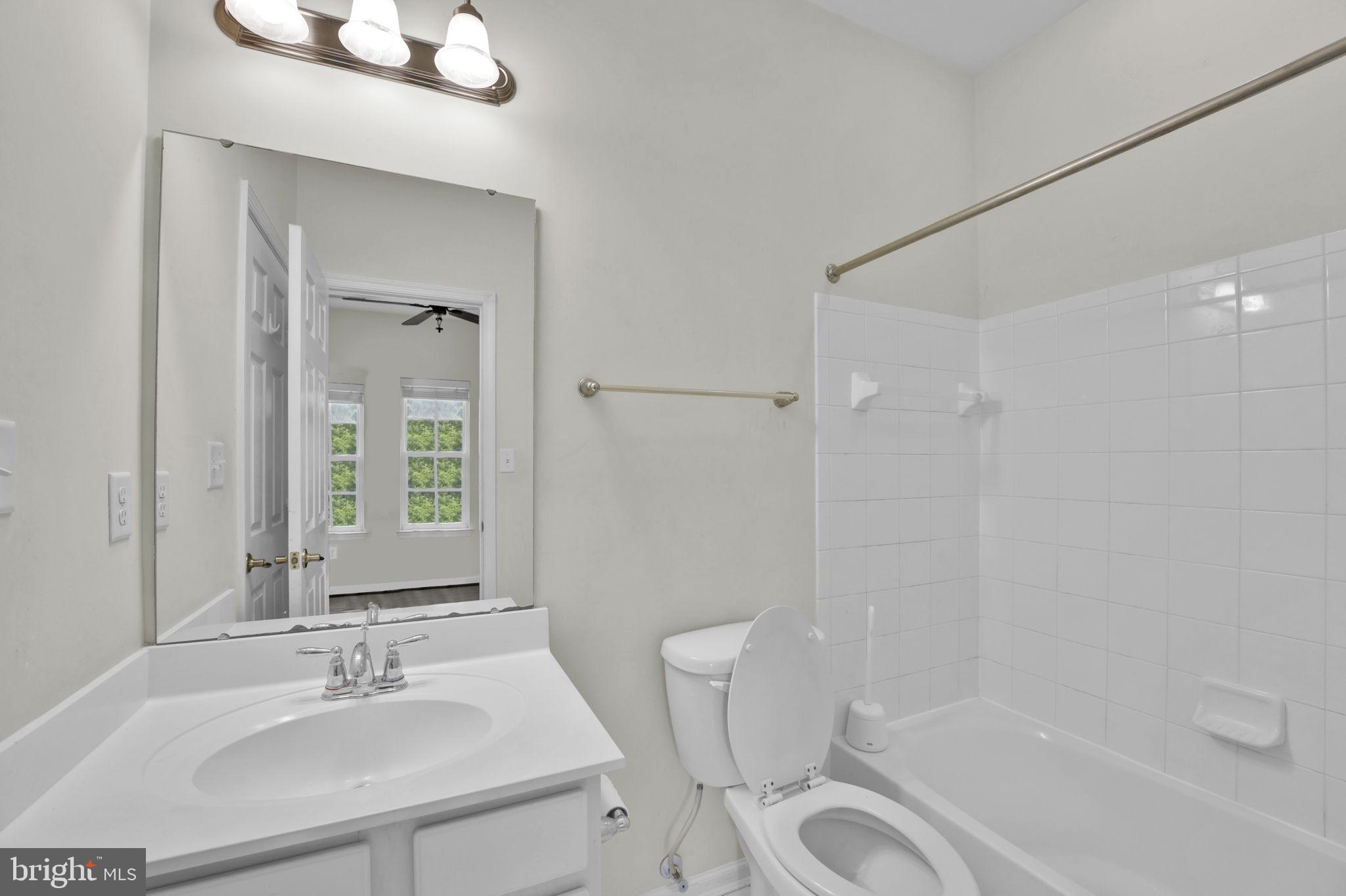 7138 Station House Road Elkridge, MD 21075 - Photo 10 of 42 a bathroom with a sink a toilet and shower