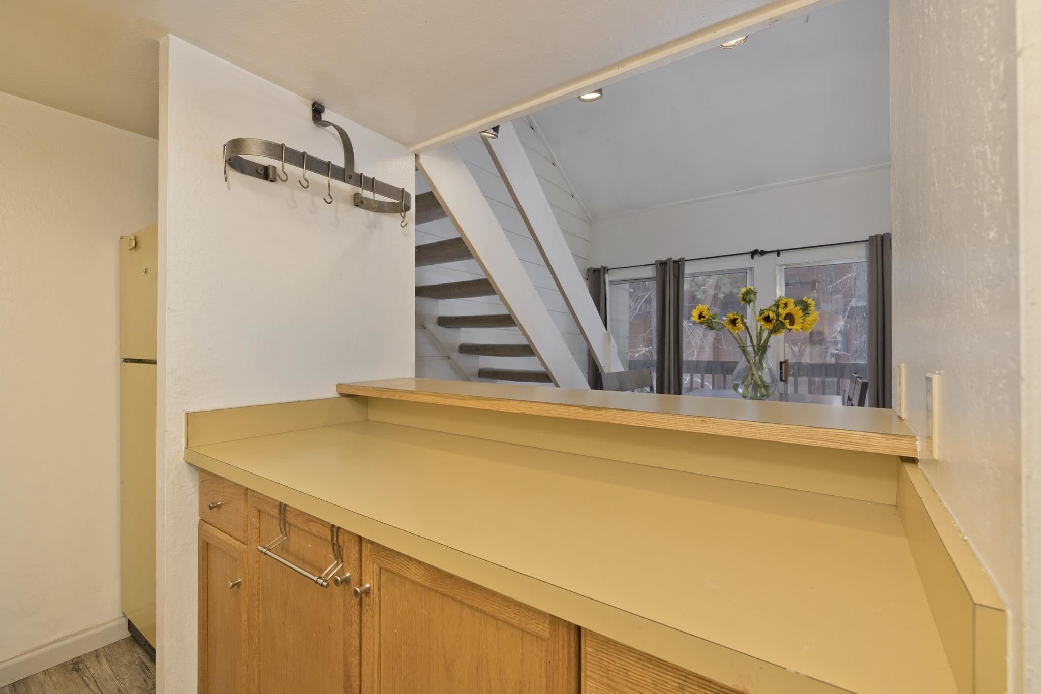 2289 Sierra Nevada Road, Unit G10 Mammoth Lakes, CA 93546 - Photo 8 of 23 Bar area featuring light countertops and freestanding refrigerator
