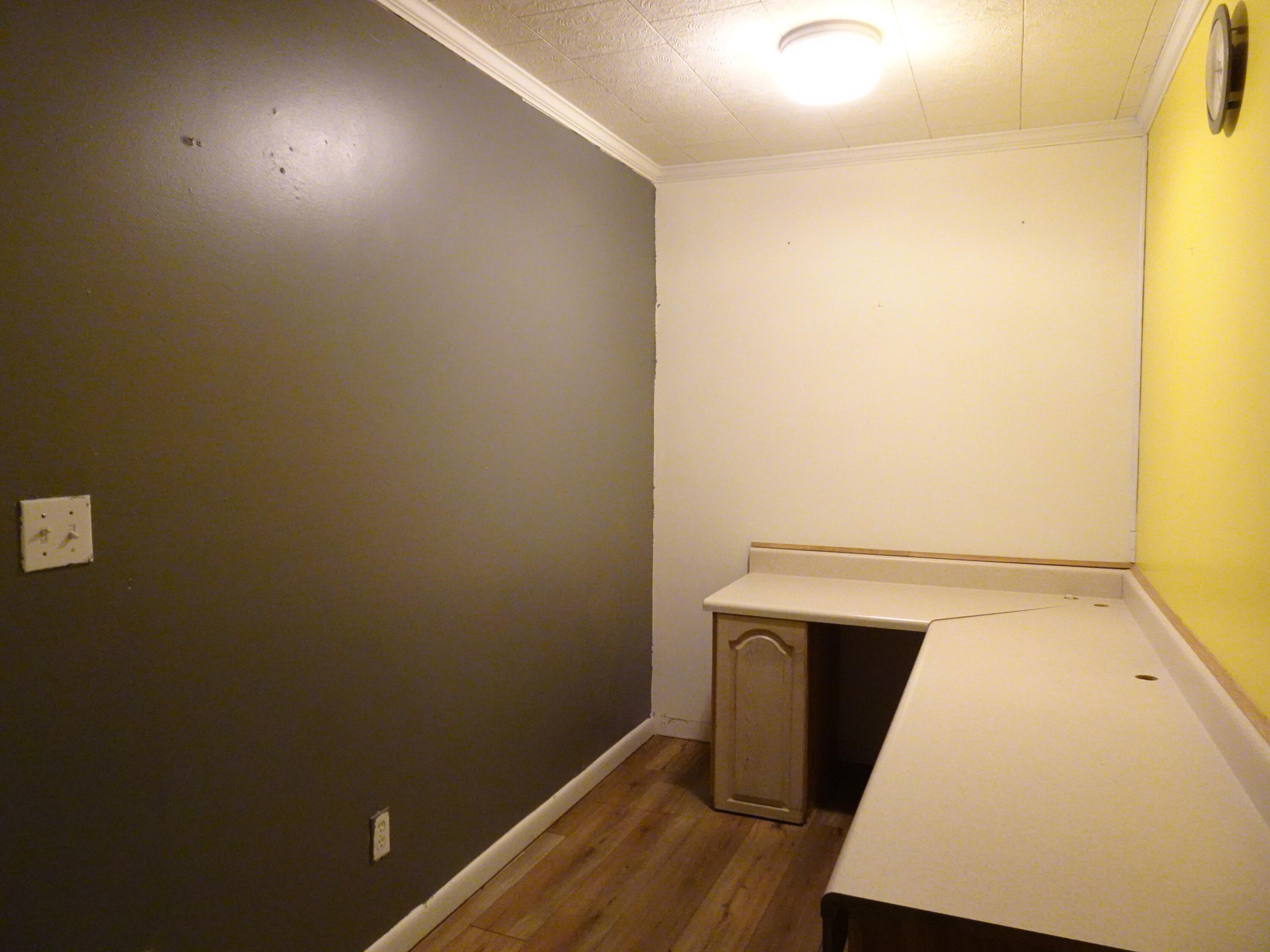 195 Heather Lane DeFuniak Springs, FL 32433 - Photo 11 of 20 a view of storage and utility room with wooden floor