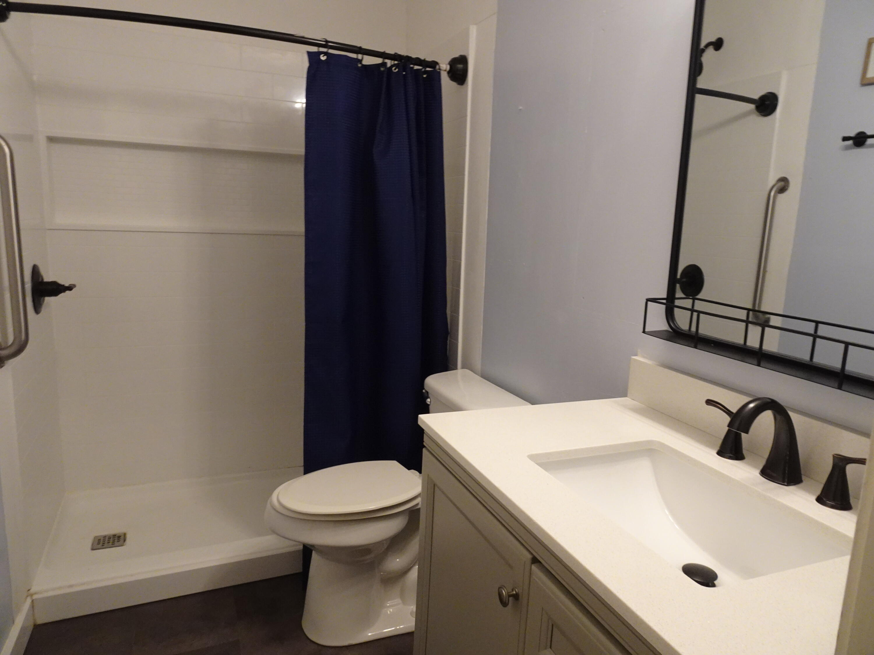 195 Heather Lane DeFuniak Springs, FL 32433 - Photo 12 of 20 a bathroom with a sink toilet and shower