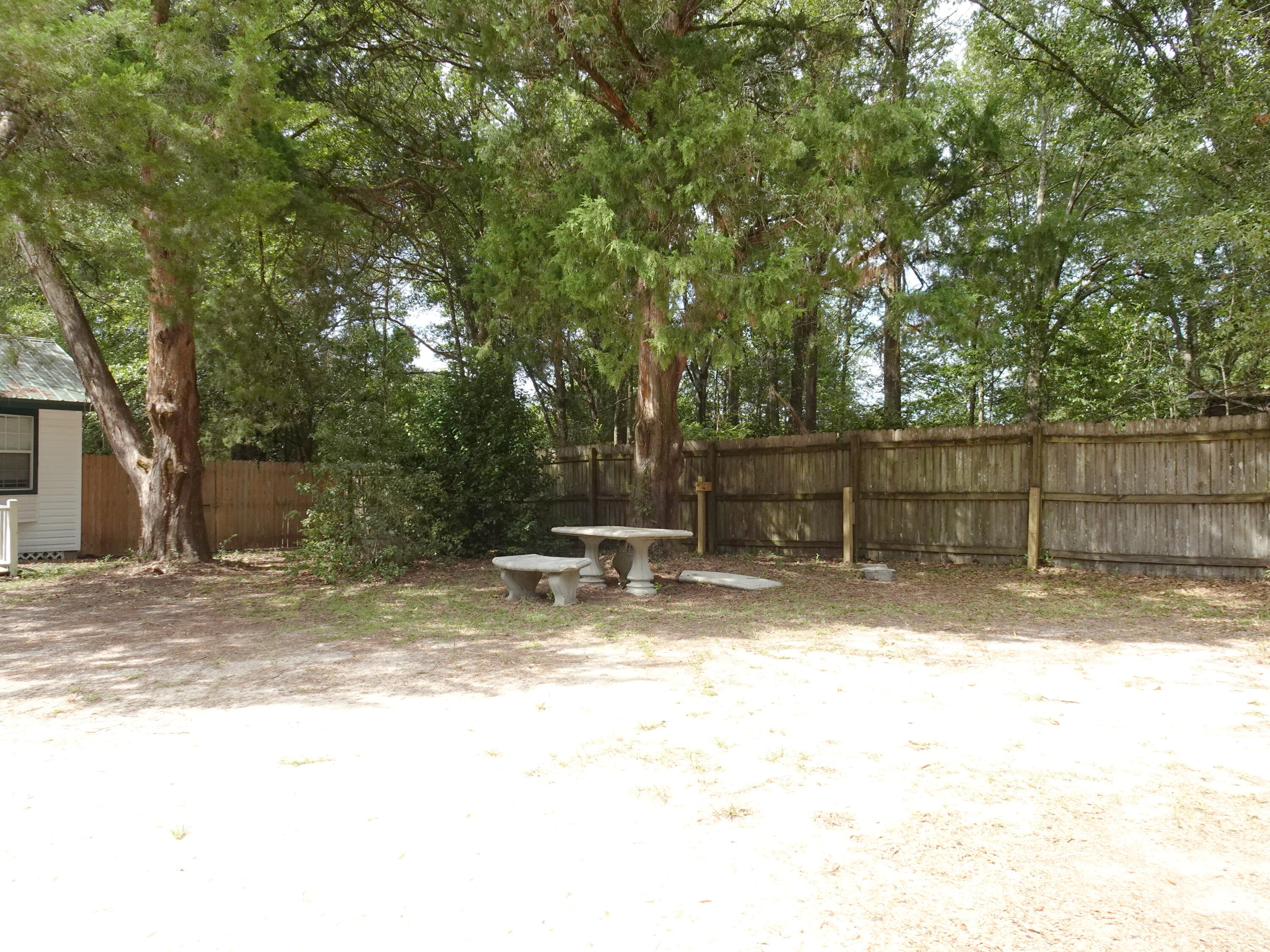 195 Heather Lane DeFuniak Springs, FL 32433 - Photo 19 of 20 a view of a yard with a tree