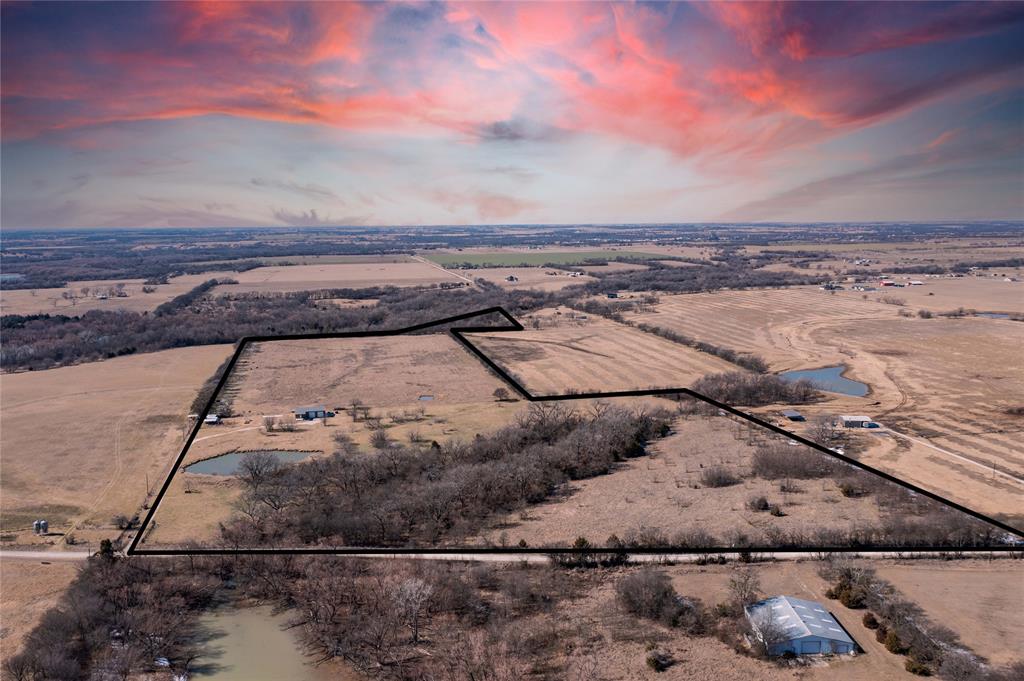 a view of a backyard of the house