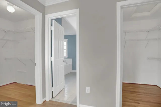 a view of a bathroom from a hallway