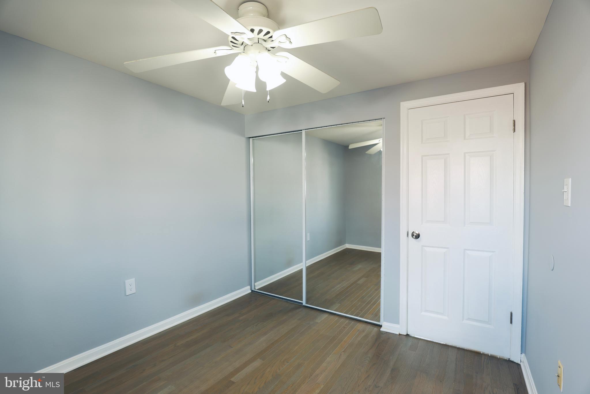 4393 Pembrook Village Drive, Unit 84 Alexandria, VA 22309 - Photo 24 of 38 an empty room with closet and a ceiling fan