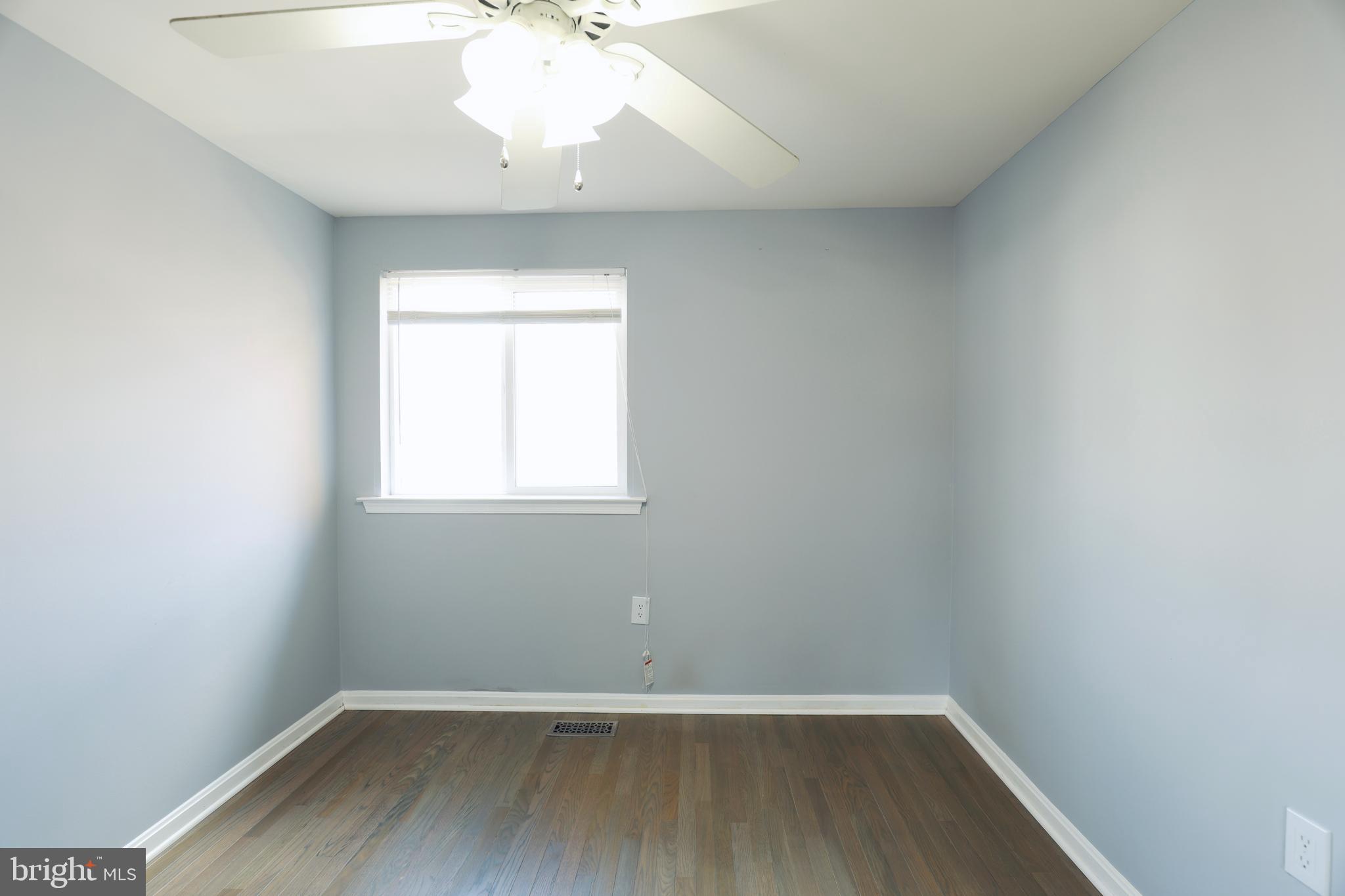 4393 Pembrook Village Drive, Unit 84 Alexandria, VA 22309 - Photo 25 of 38 wooden floor in an empty room with a window