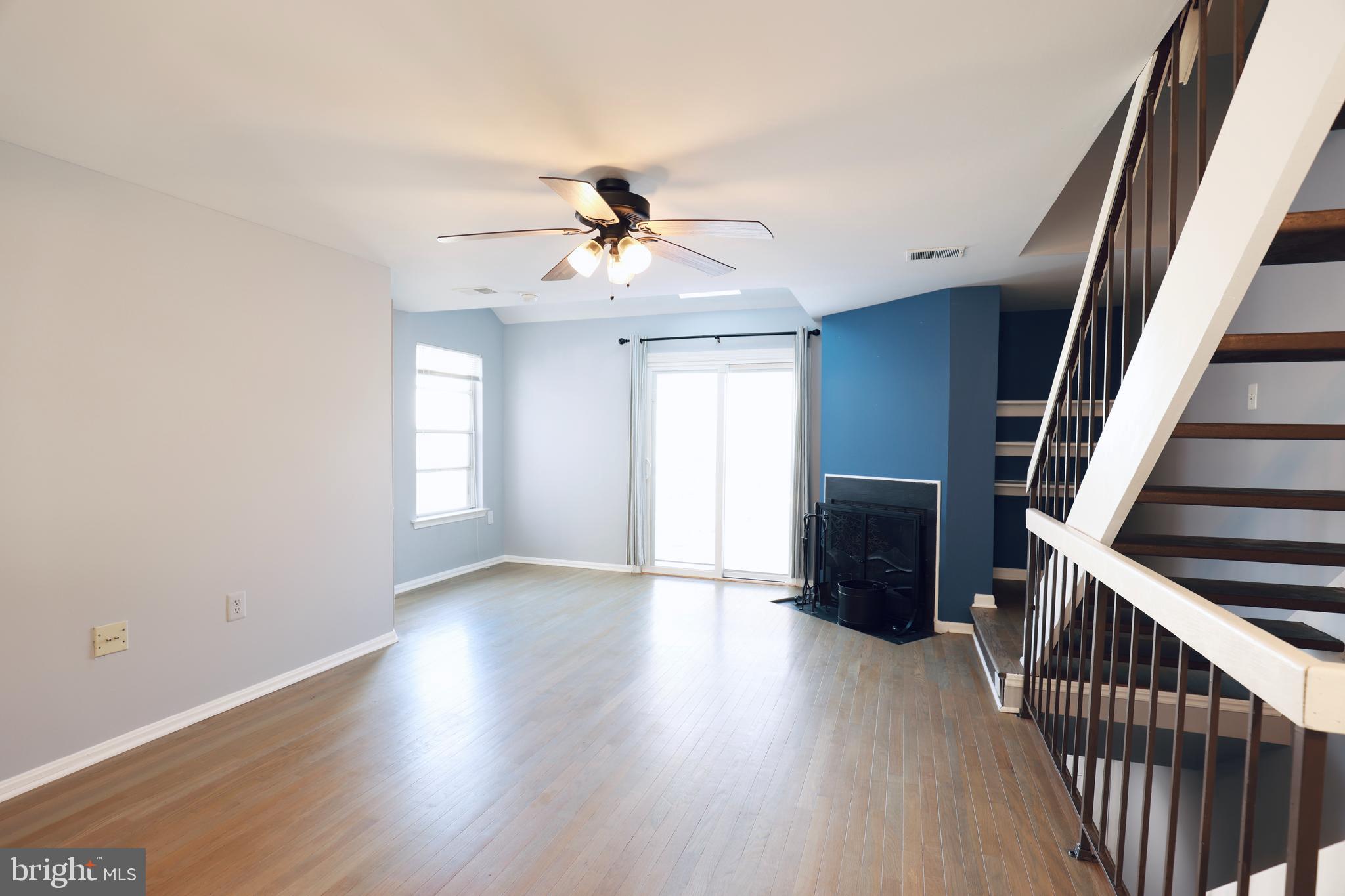 4393 Pembrook Village Drive, Unit 84 Alexandria, VA 22309 - Photo 3 of 38 wooden floor in an empty room with a window
