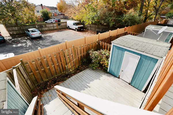 a front view of a house with entryway and wooden walls