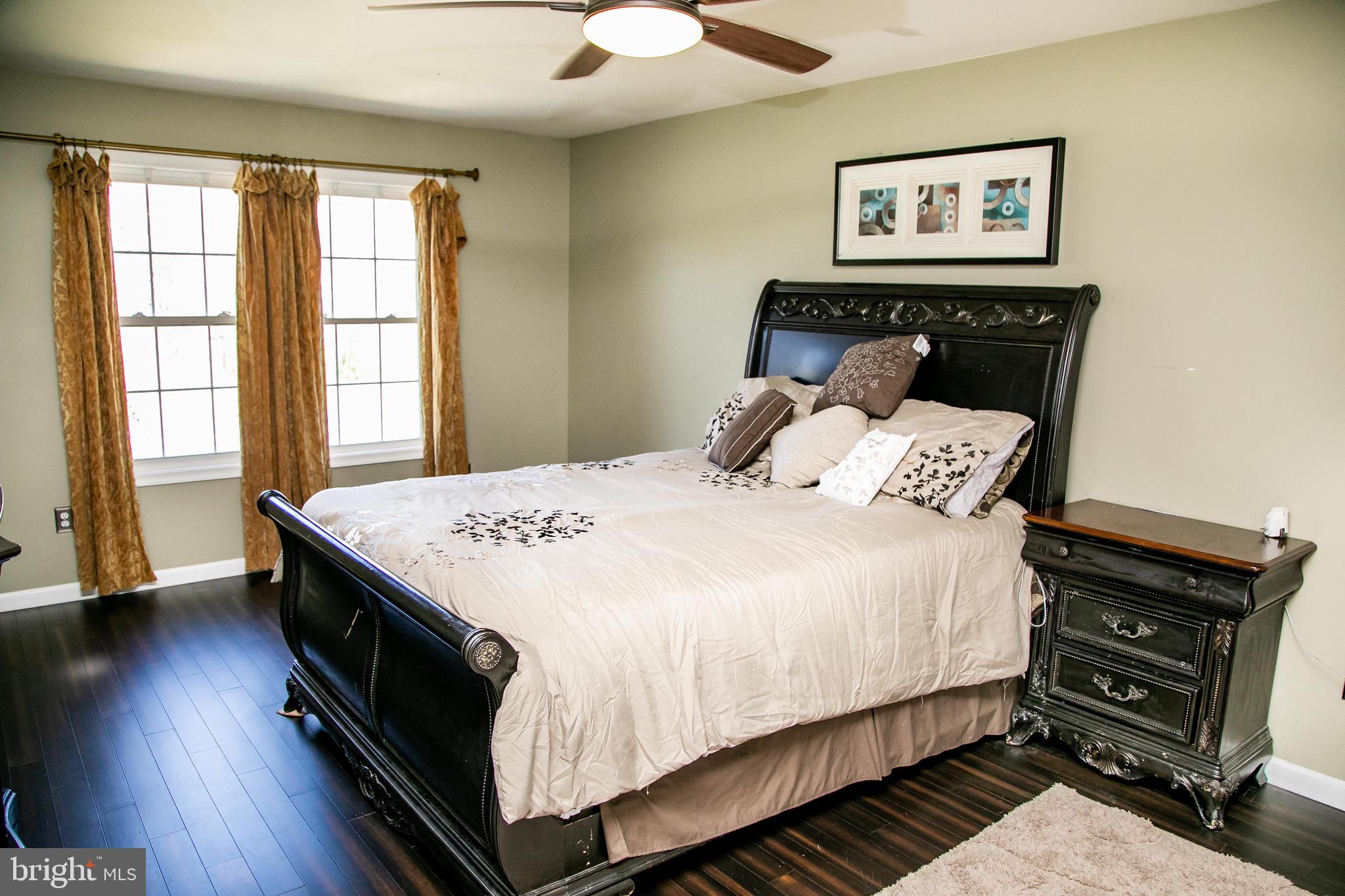 4299 Allen Road Eden, MD 21822 - Photo 26 of 54 a bedroom with a bed and wooden floor