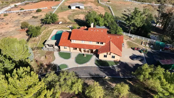 an aerial view of a house with a garden