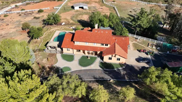 an aerial view of a house with a garden
