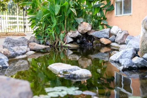 a living room with furniture a large window with outer view