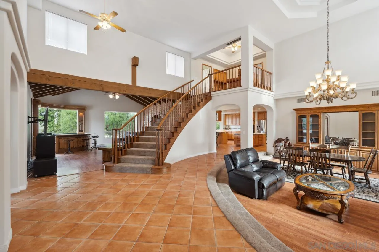 15091 Chemise Creek Road Ramona, CA 92065 - Photo 37 of 74 a living room with furniture and a chandelier