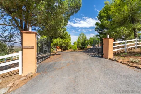 an aerial view of a house with yard swimming pool and outdoor seating