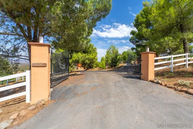 an aerial view of a house with yard swimming pool and outdoor seating