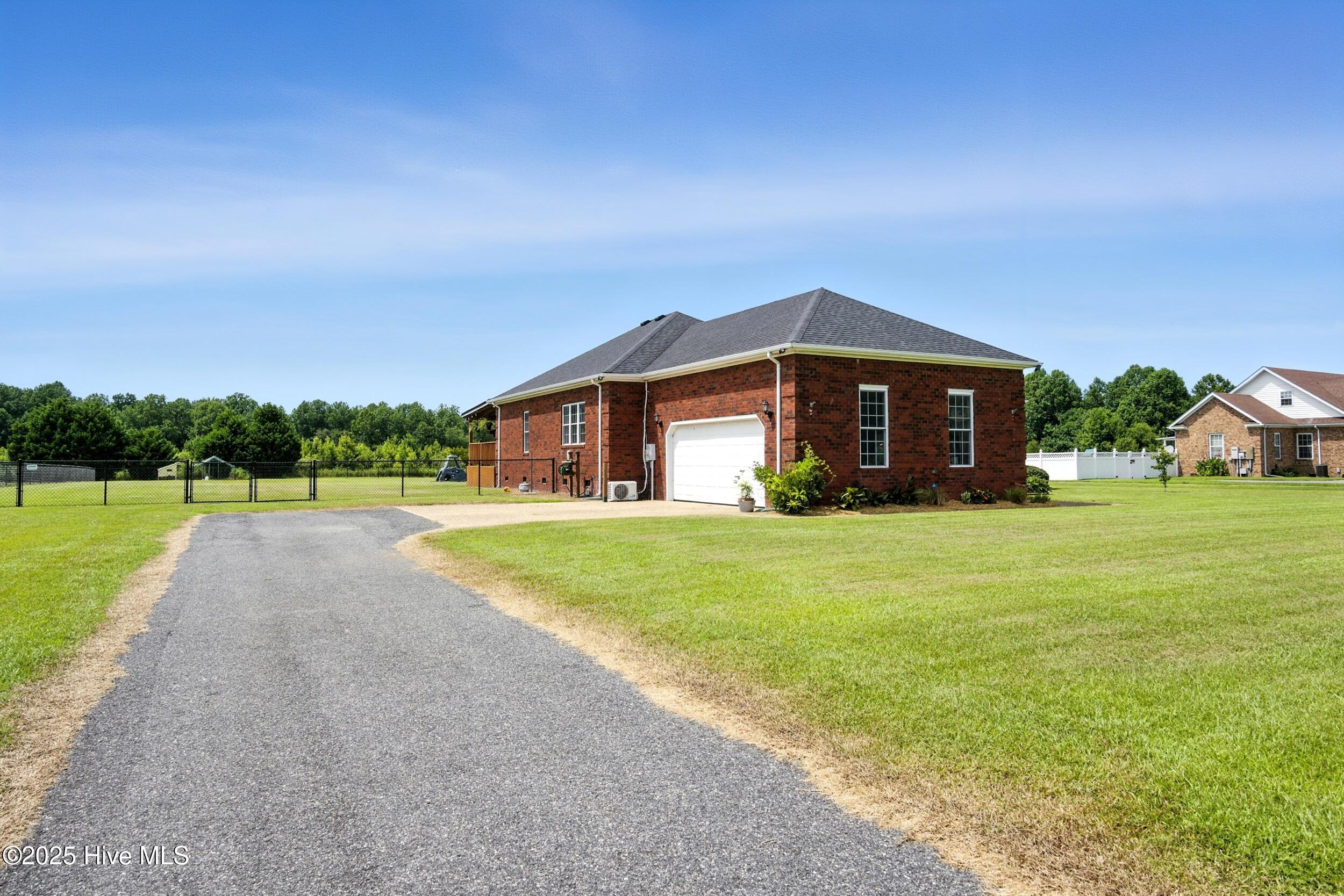 202 Lee's Mill Road Gates, NC 27937 - Photo 52 of 54 Sideload double attached garage with plenty of driveway space