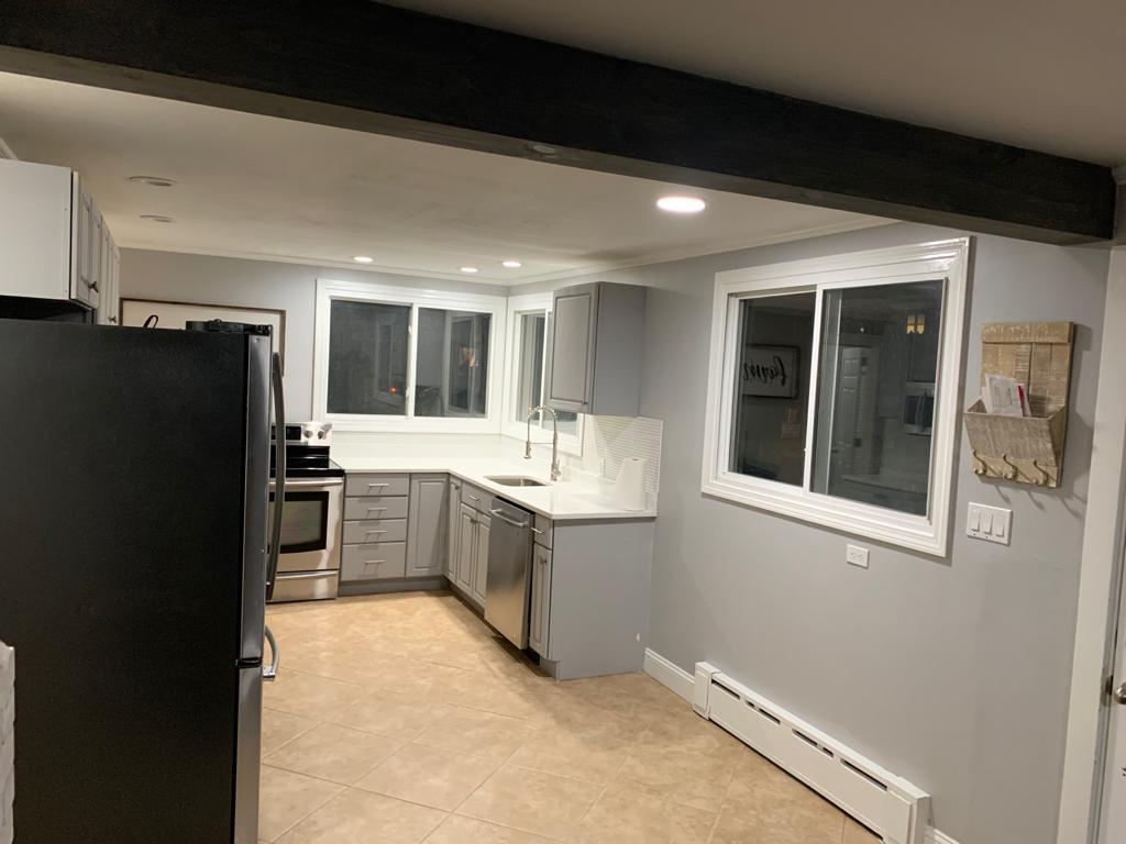 30 Dunns Pond Road Hyannis, MA 02601 - Photo 11 of 33 a kitchen with a refrigerator and a sink