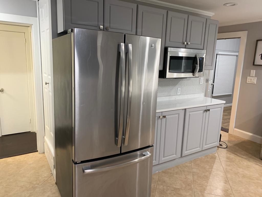 30 Dunns Pond Road Hyannis, MA 02601 - Photo 14 of 33 a metallic refrigerator freezer sitting in a kitchen