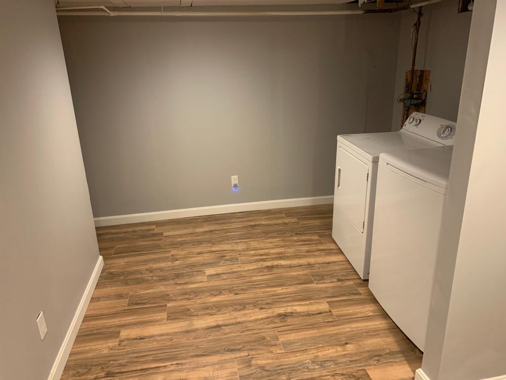 30 Dunns Pond Road Hyannis, MA 02601 - Photo 22 of 33 a view of a room with wooden floor and washer