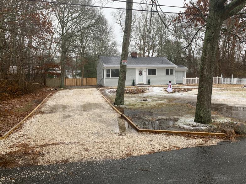 30 Dunns Pond Road Hyannis, MA 02601 - Photo 5 of 33 a white house that has a tree in front of it