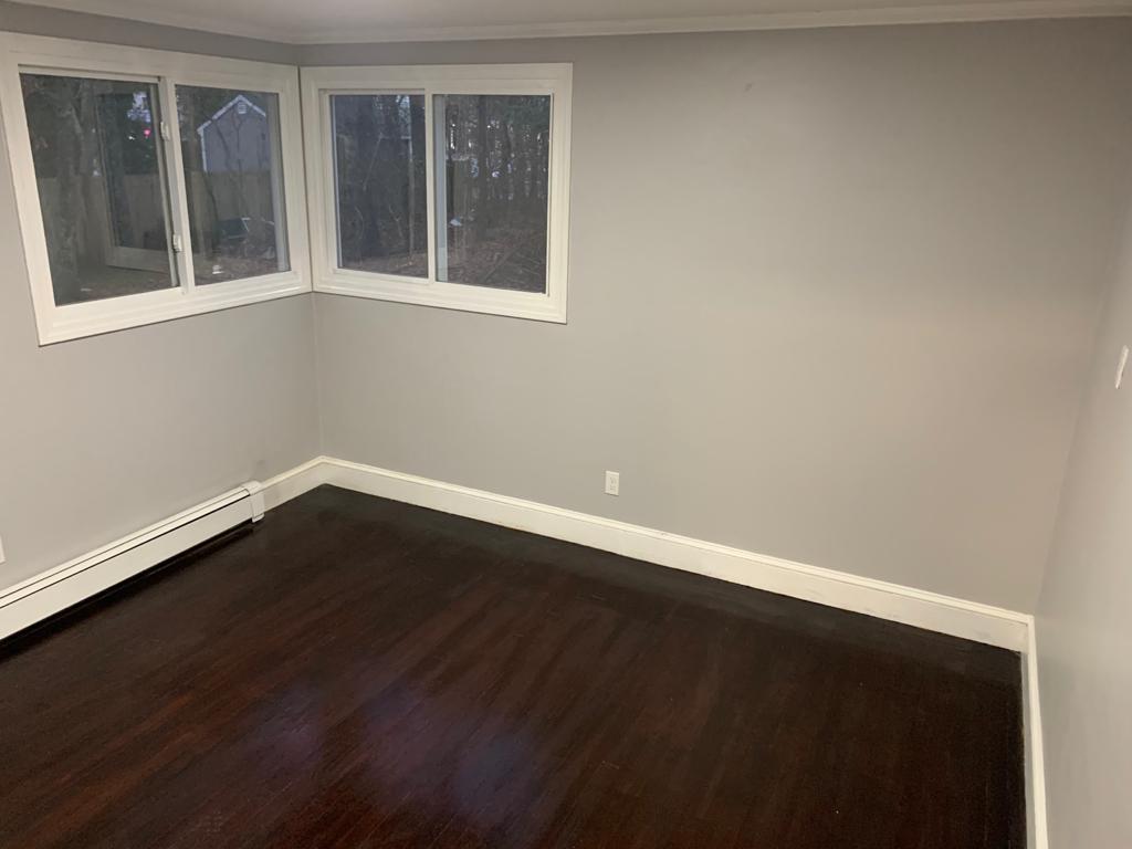 30 Dunns Pond Road Hyannis, MA 02601 - Photo 7 of 33 a view of an empty room with wooden floor and a window