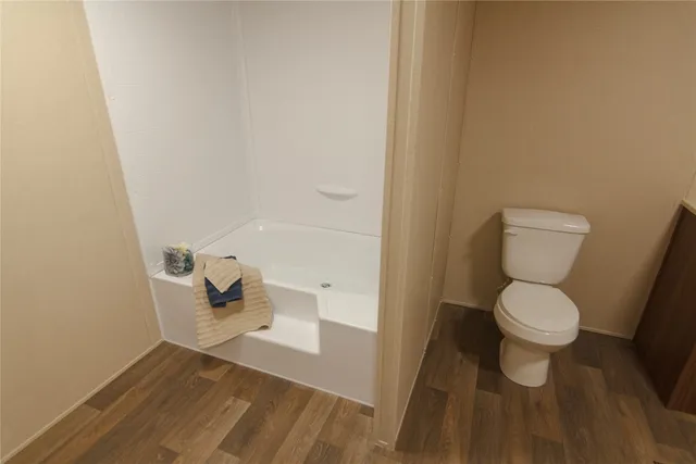 a bathroom with a toilet and a sink