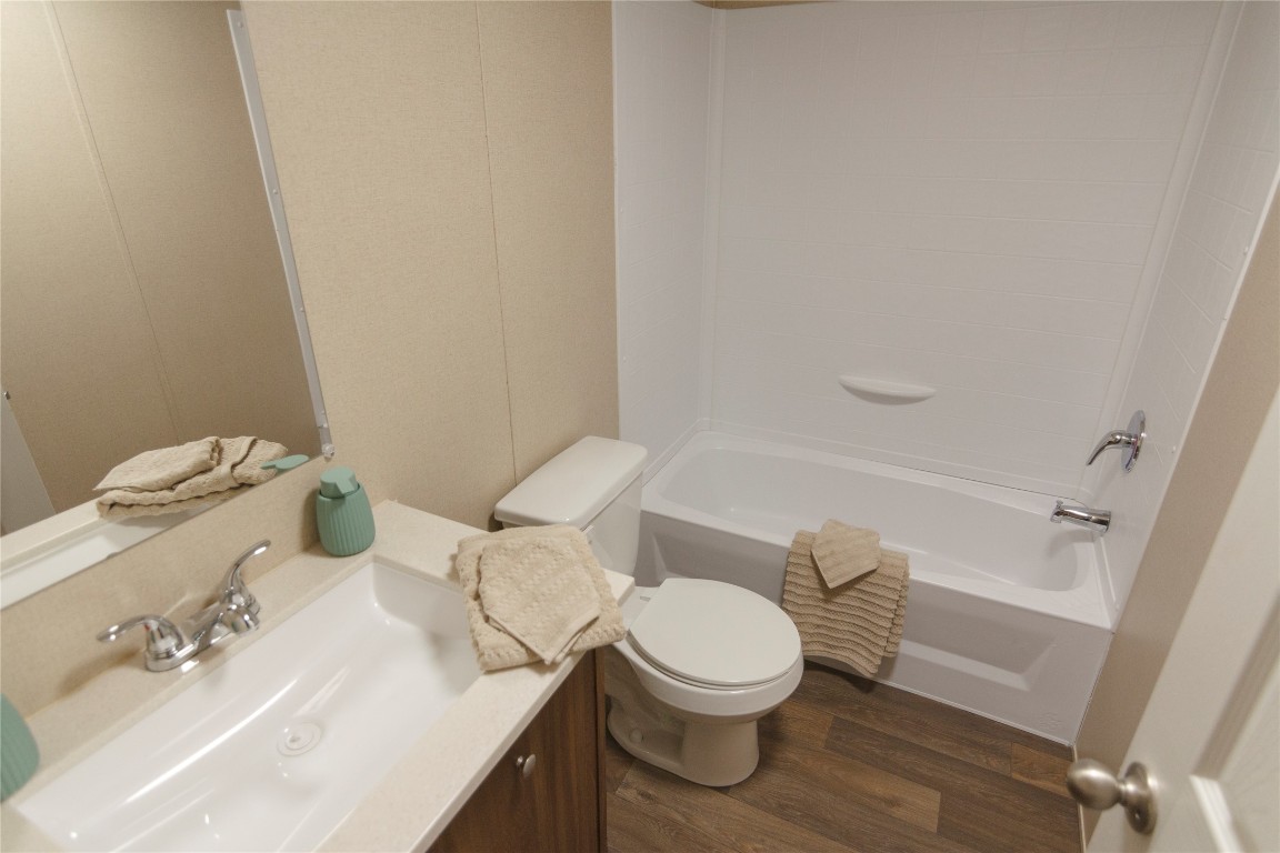 1977 Jeddo Road Rosanky, TX 78953 - Photo 18 of 30 a white toilet sitting next to a bathroom sink