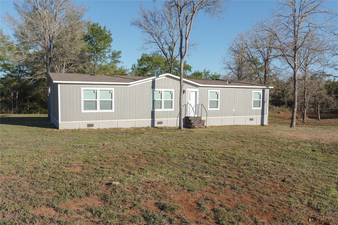 1977 Jeddo Road Rosanky, TX 78953 - Photo 3 of 30 front view of a house with a yard