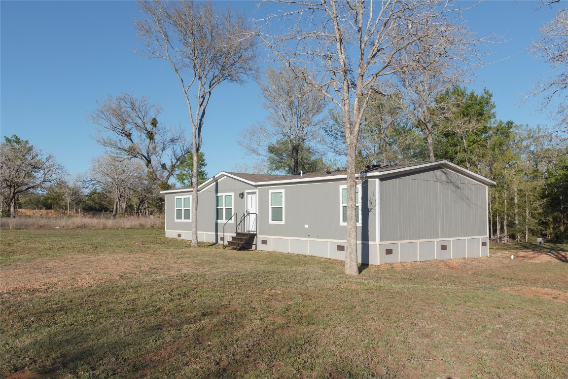 1977 Jeddo Road Rosanky, TX 78953 - Photo 5 of 30 a view of house with a yard and large tree