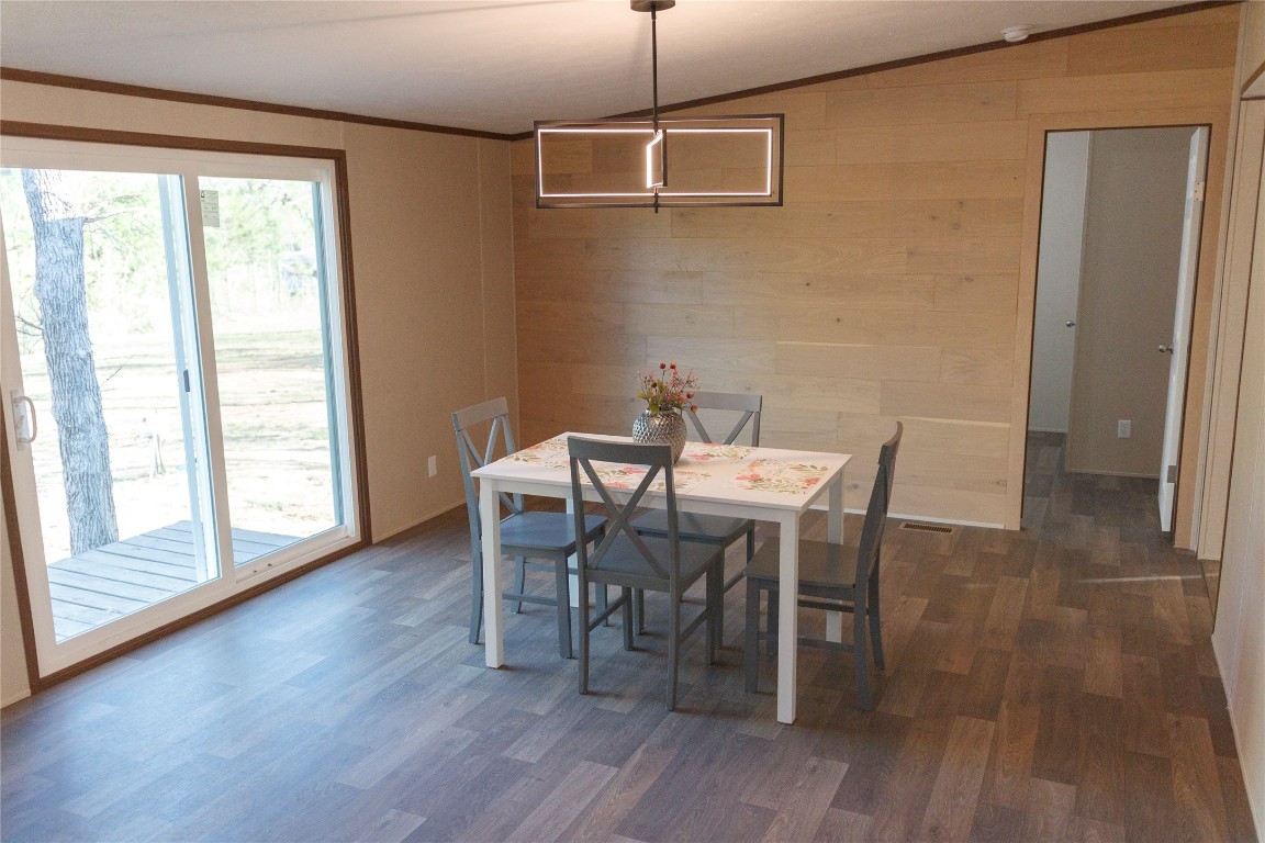 1977 Jeddo Road Rosanky, TX 78953 - Photo 7 of 30 a dining room with furniture and wooden floor